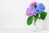 Still life with a beautiful bouquet of pink and blue hydrangea flowers. holiday or wedding background with copy space