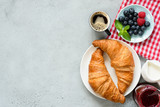 Fototapeta Mapy - Continental Breakfast Croissants Coffee Berries Jam On Concrete Background, Top View, Copy Space