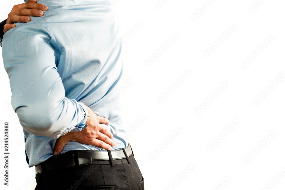 Spine pain. Man has got problems with his spine. He put his hand on his ...