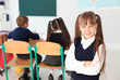 © New Africa - Little girl in classroom. Stylish school uniform