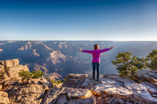 Girl In Purple Hoodie Is Standing On The Edge Of Grand Canyon