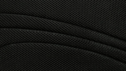 Black nylon fabric pattern texture background.