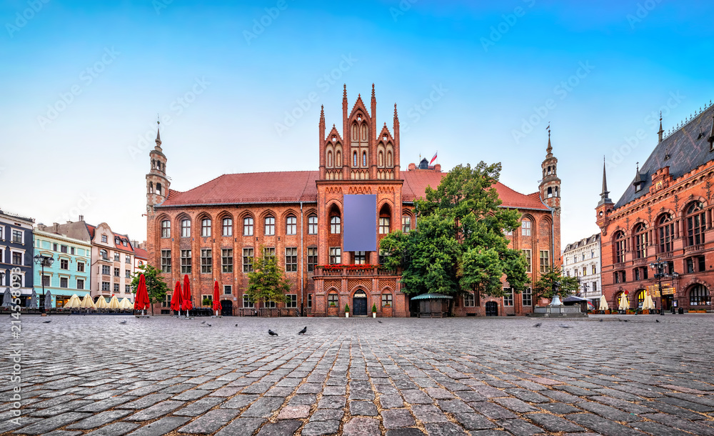 Gothic facade of Old Town Hall of Torun located on Old Market square, Poland - obrazy, fototapety, plakaty 
