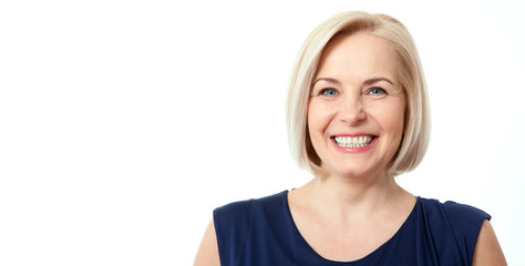 Wall Mural - attractive middle aged woman with beautiful smile on white background