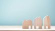 Close up diffirance three wood house model on blue background, Choose home the best for you, Planning to buy property.