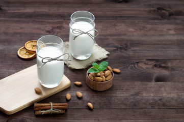 Almond milk,two glasses on the table with almond.