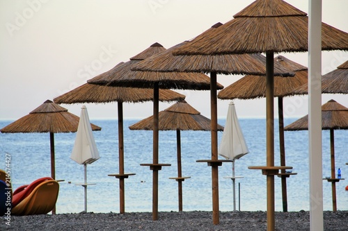 Parasol En Paille Sur Une Plage Des éoliennes Buy This