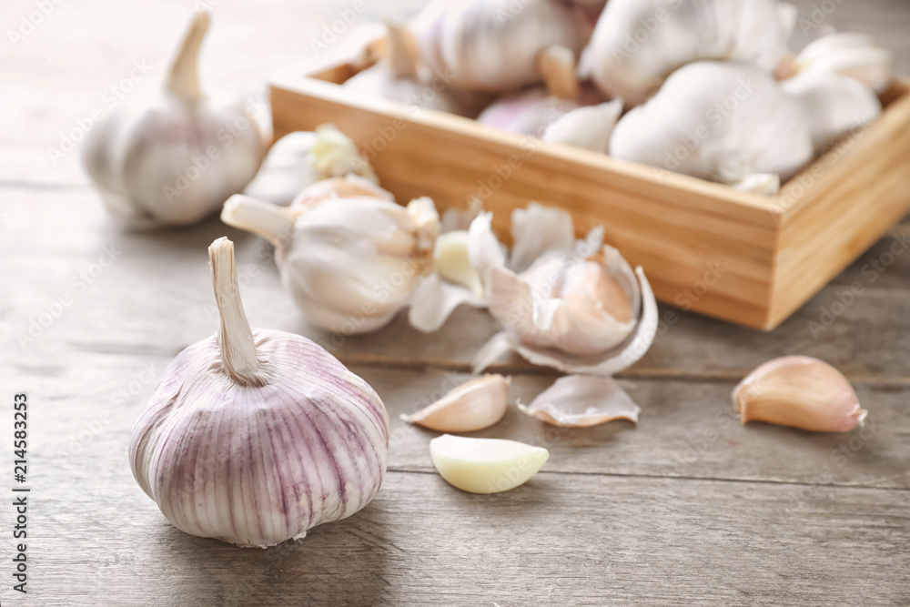 Fresh garlic on wooden background