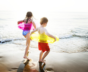 Wall Mural - Kids playing at the beach