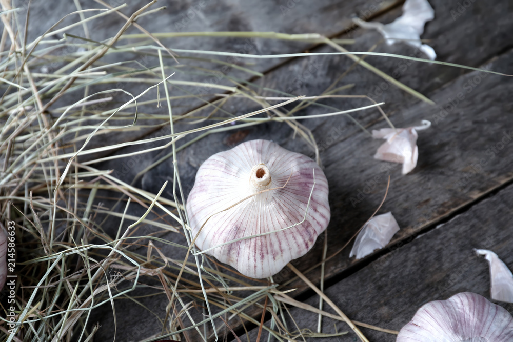 Fresh garlic on wooden background