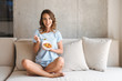 © Drobot Dean - Delighted young woman eating healthy breakfast