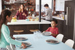 © Monkey Business - Children Helping To Lay Table Ready For Family Meal