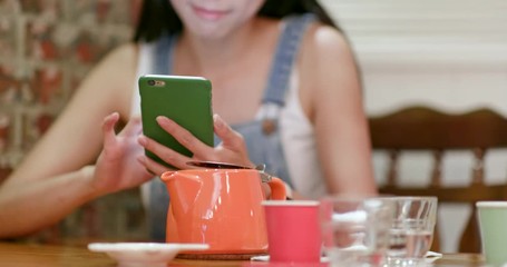 Canvas Print - Woman use of mobile phone in coffee shop