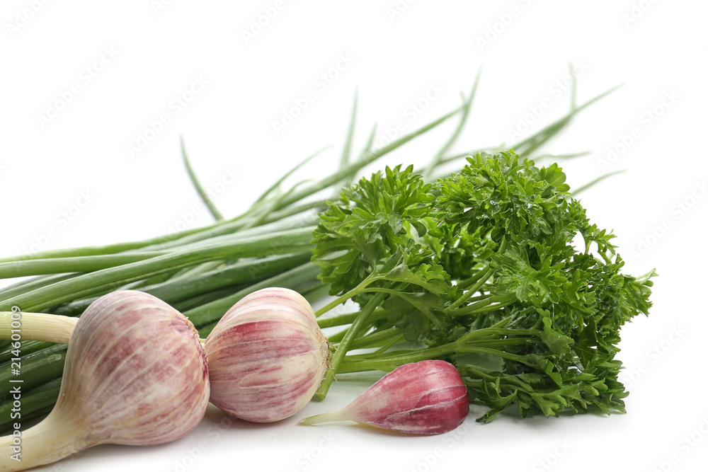 Garlic with fresh herbs on white background