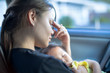© globalmoments - Tired stressed mother holding baby