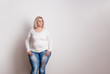 Portrait of an attractive overweight woman in studio on a white background.
