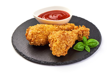 Sticker - Breaded crispy fried chicken legs with ketchup, isolated on white background.