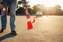Instructor Sets The Cone, Driving School Concept