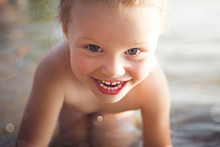 Portrait Of Beautiful Happy Smiling Little White Girl Bathing In The Sea Close Up.