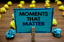 Handwriting Text Moments That Matter. Concept Meaning Meaningful Positive Happy Memorable Important Times Blurry Wooden Deck Yellow And Blue Lob On Ground Paper Clip Grip Page With Text.