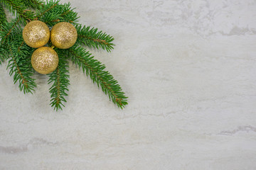 Christmas ornaments on a spruce bough with copy space