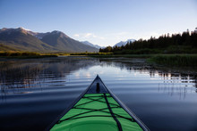 Kayaking In A Beautiful Lake Surrounded By The Canadian Mountain Landscape. Taken In Vermilion Lakes, Banff, Alberta, Canada.
