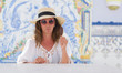 © Krakenimages.com - Middle age brunette woman eating ice cream with a confident expression on smart face thinking serious