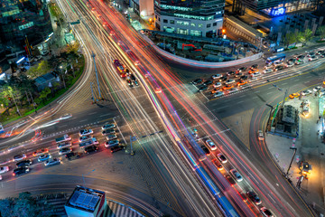 Wall Mural - Night scene of light trails traffic speeds through an intersection in Gangnam center business district of Seoul at Seoul city, South Korea.