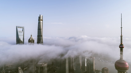 Skyscrapers above the dramatic clouds in Shanghai