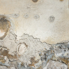 Old Wall With Peel Grey Stucco Texture. Retro Vintage Worn Wall Background. Decayed Cracked Rough Abstract Wall Surface.