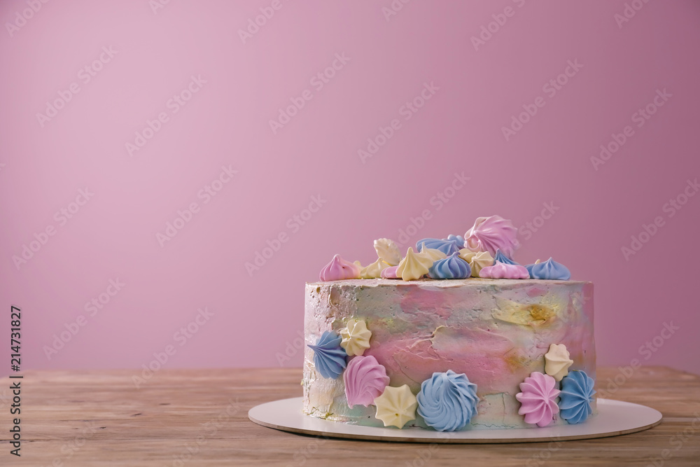 Beautiful tasty birthday cake on wooden table