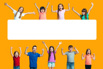 Happy success teensl celebrating being a winner. Dynamic energetic image of happy children