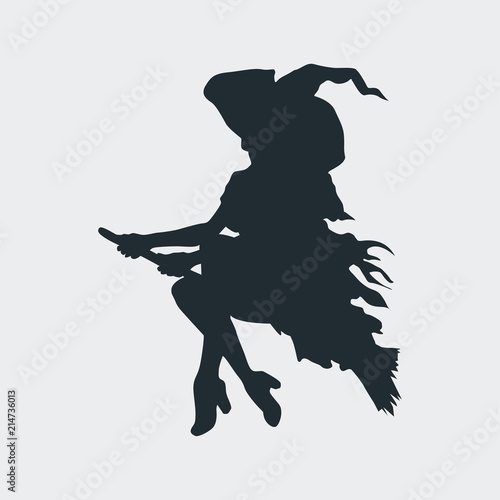 Fotografía Icono plano silueta bruja en escoba en fondo gris
