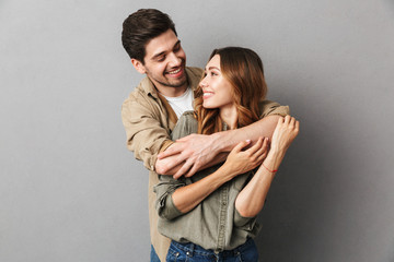 portrait of a happy young couple hugging
