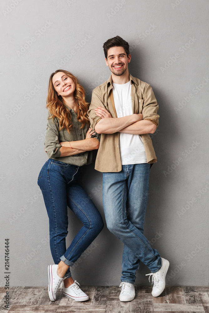 Full length portrait of a cheerful young couple Stock Photo | Adobe Stock