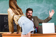 Teacher or school principal punishes slapping buttocks sexy girl student. Student in mini skirt with sexy buttocks waits for punishment. Role game concept. School behaviour discipline and punishment