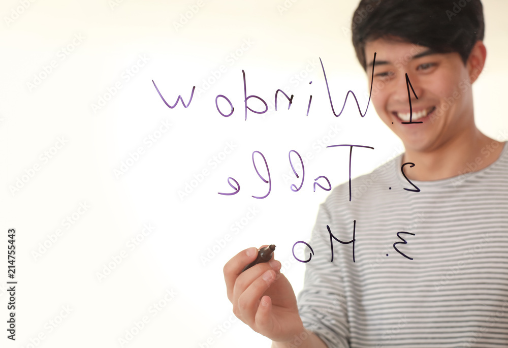 Young man giving presentation during business meeting in office