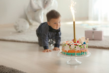 Delicious Birthday Cake With Firework Candle For Cute Little Boy In Room