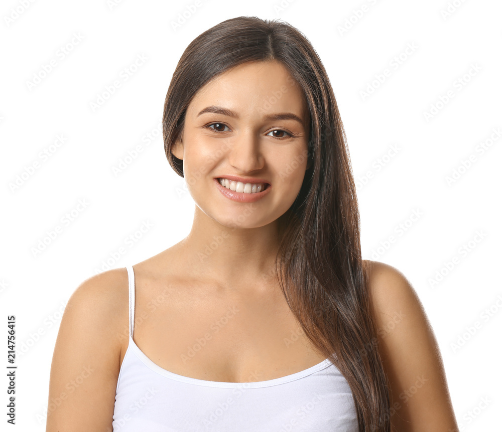 Beautiful young woman with healthy teeth on white background
