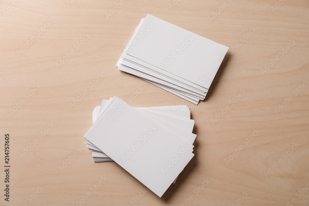 Blank business cards on wooden background