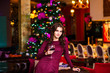 © fotofrol - The girl at restaurant with a champagne glass for new year
