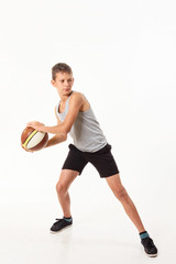 Wall Mural - teenager with a basketball on a white background.