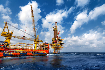 technician or worker on the crew boat during transfer to platform or drilling rig in process oil and