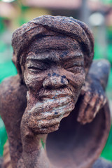 stone face of man vietnam statue