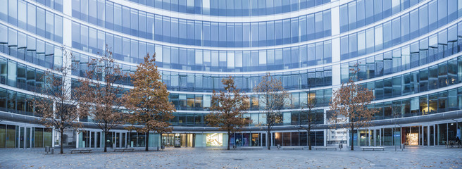 Modern office buildings and trees in an autumn robe