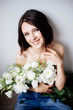 © Alina Kulbashnaia - Beautiful girl with a bouquet flowers.