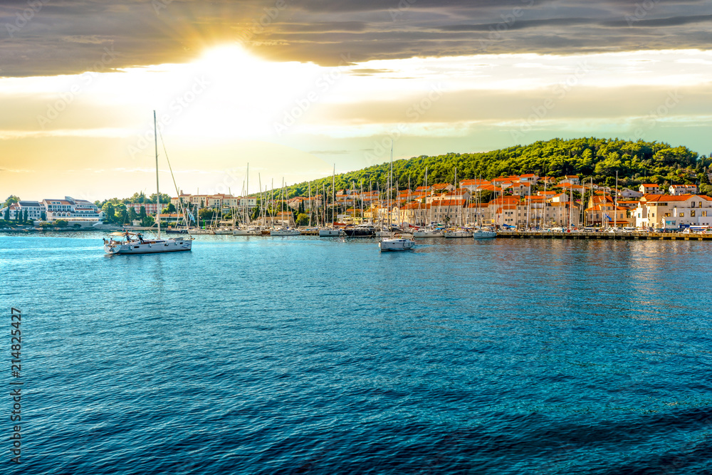 Boats in the harbor of the Croatian coastal city of Hvar, one of the many Islands near Dubrovnik and Korcula on the Dalmatian Coast of Croatia - obrazy, fototapety, plakaty 