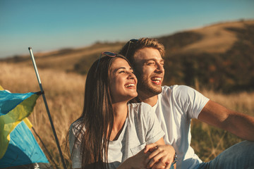 Sticker - Happy young couple enjoys a sunny day in nature