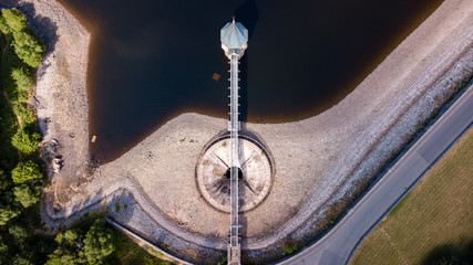 Wall Mural - aerial drone view of low water levels in a reservoir during a summer drought