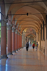 Wall Mural - Bologna, Italy, local and tourists walking in Santo Stefano square portico. 